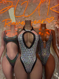 Black scoop-neck bodysuit with large oval back cutout and high-leg coverage