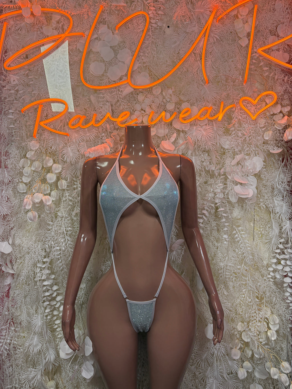 Silver metallic halter bodysuit with deep cutout and thong bottom