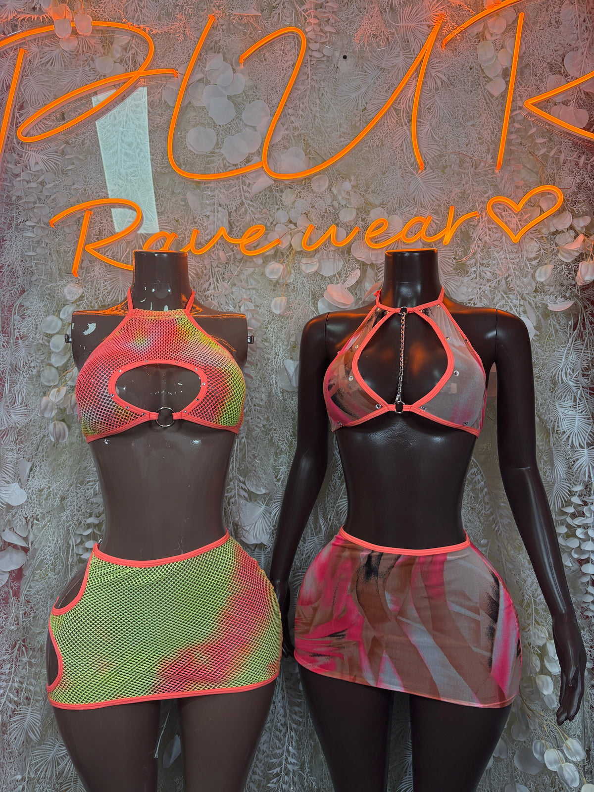 Two-piece festival set: red-orange mesh keyhole crop top with multicolor mini skirt