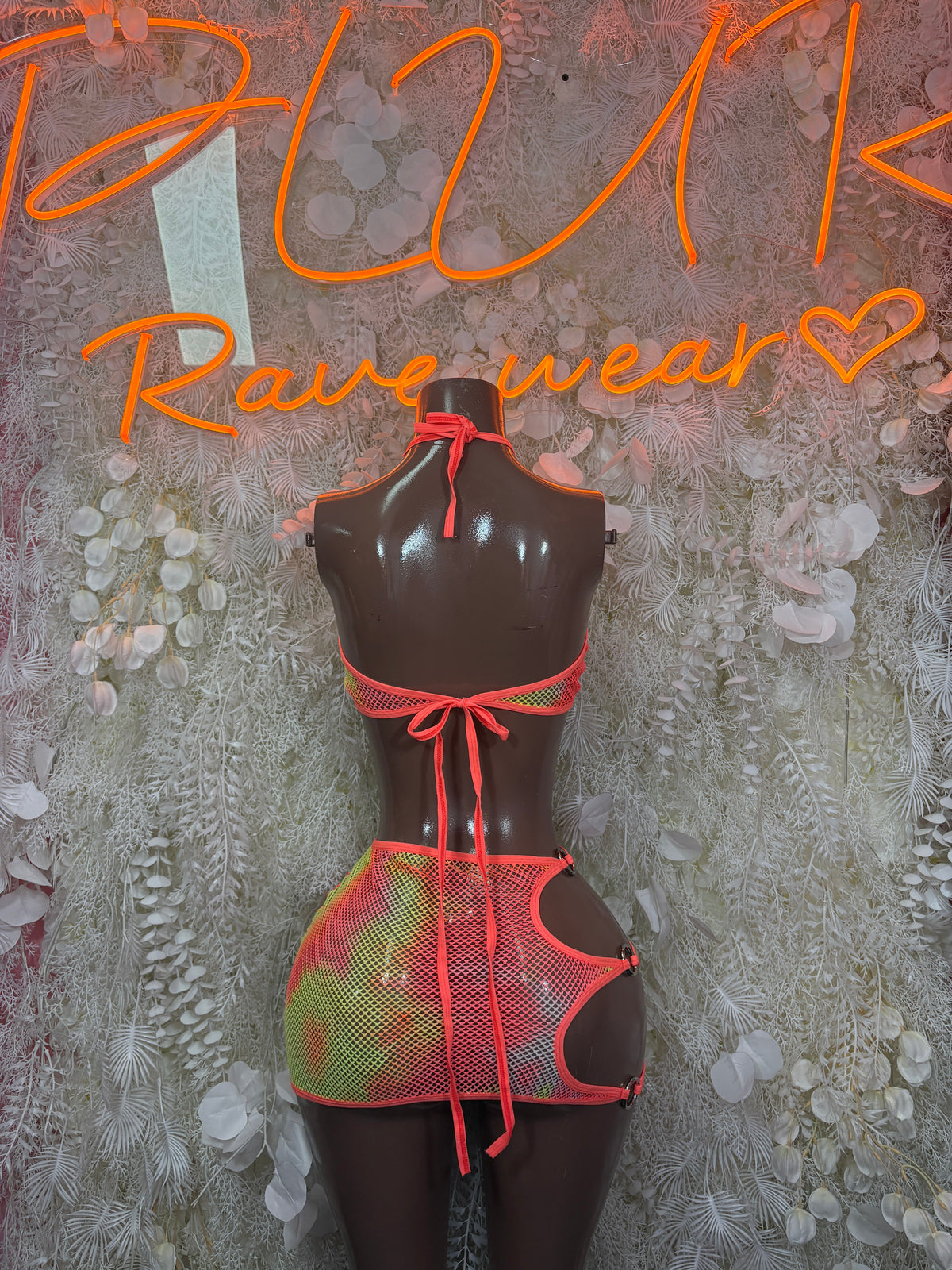 Two-piece festival set: orange mesh keyhole crop top with multicolor mini skirt