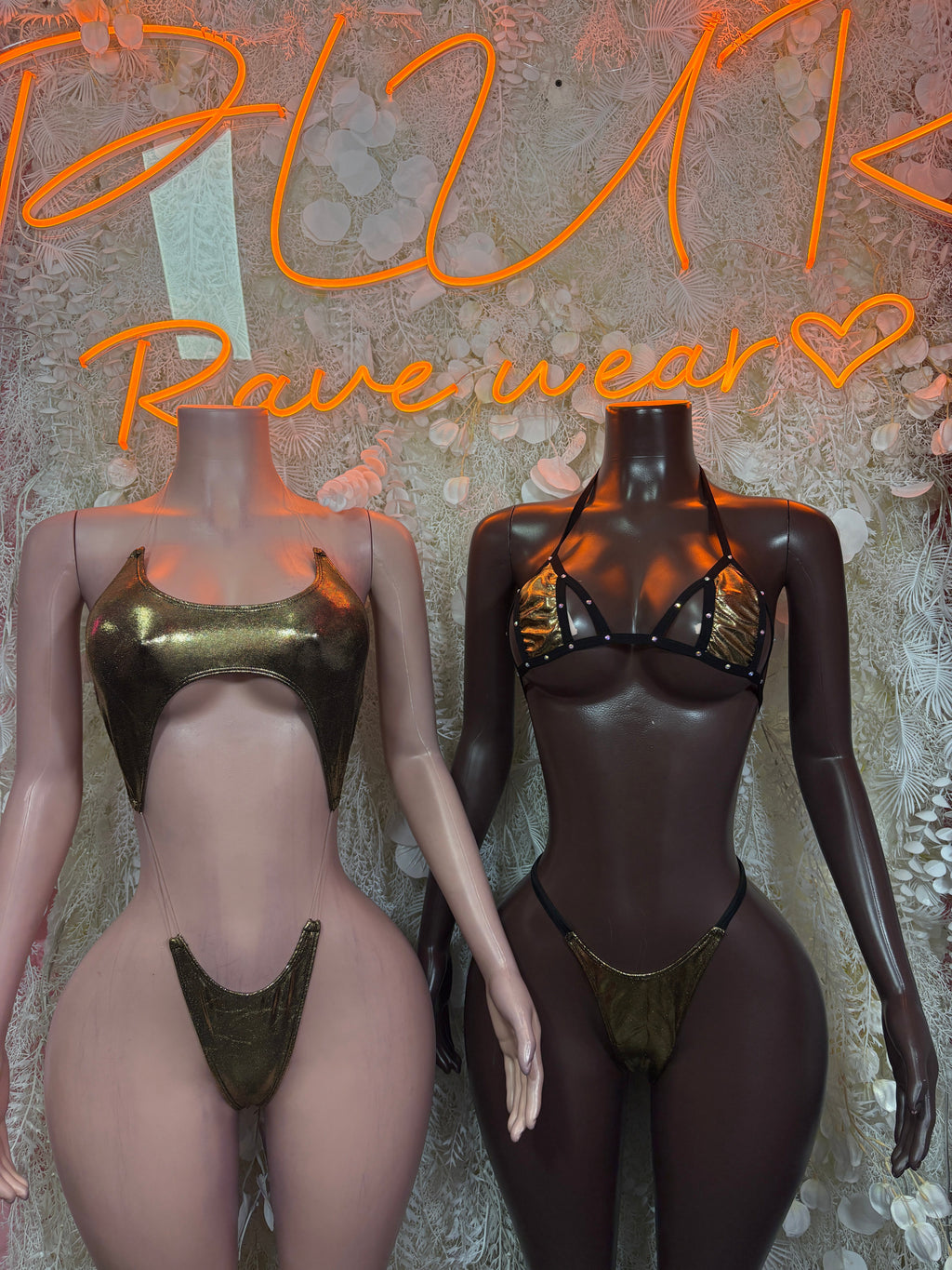 Cutout bodysuit with halter straps, high-cut legs, thong back in olive and black.