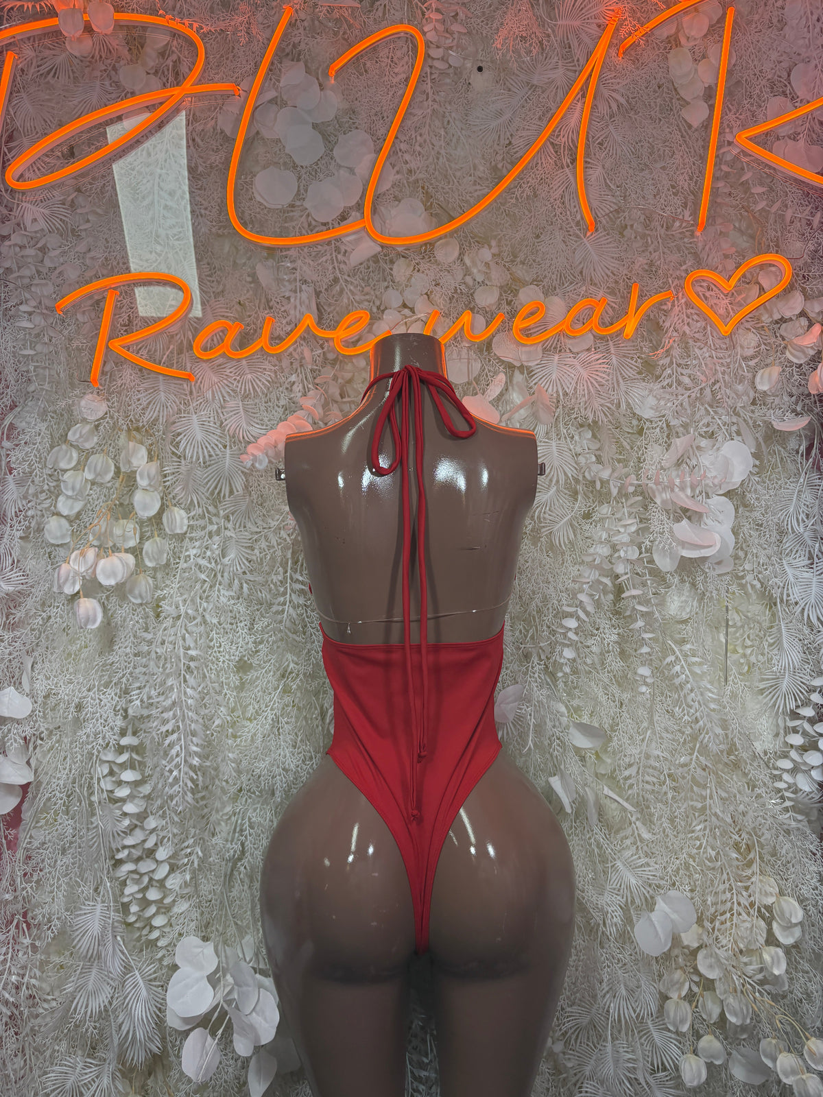 Red backless bodysuit with tie halter strings and open back cutouts
