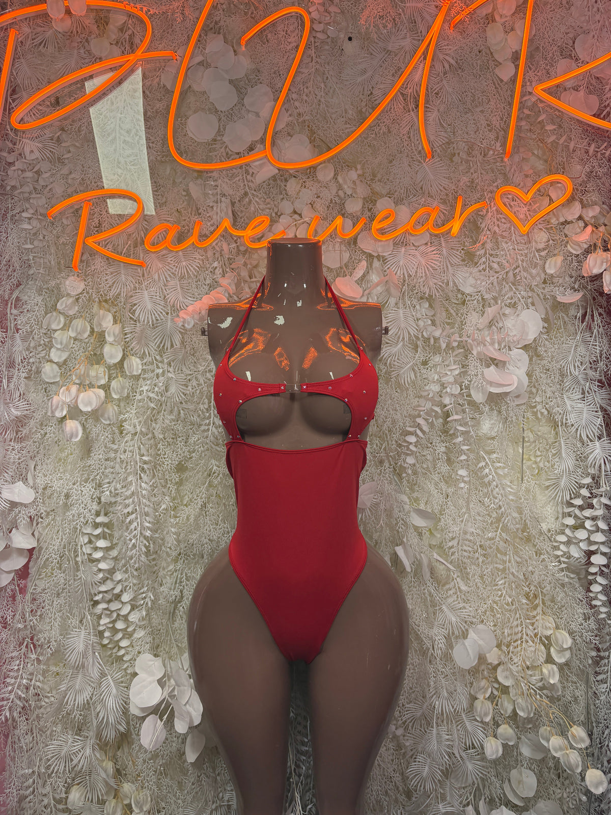 Red strappy cutout bodysuit with halter neckline and front chest cutouts